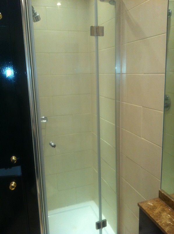 Frameless glass shower enclosure with chrome fittings in Banbury