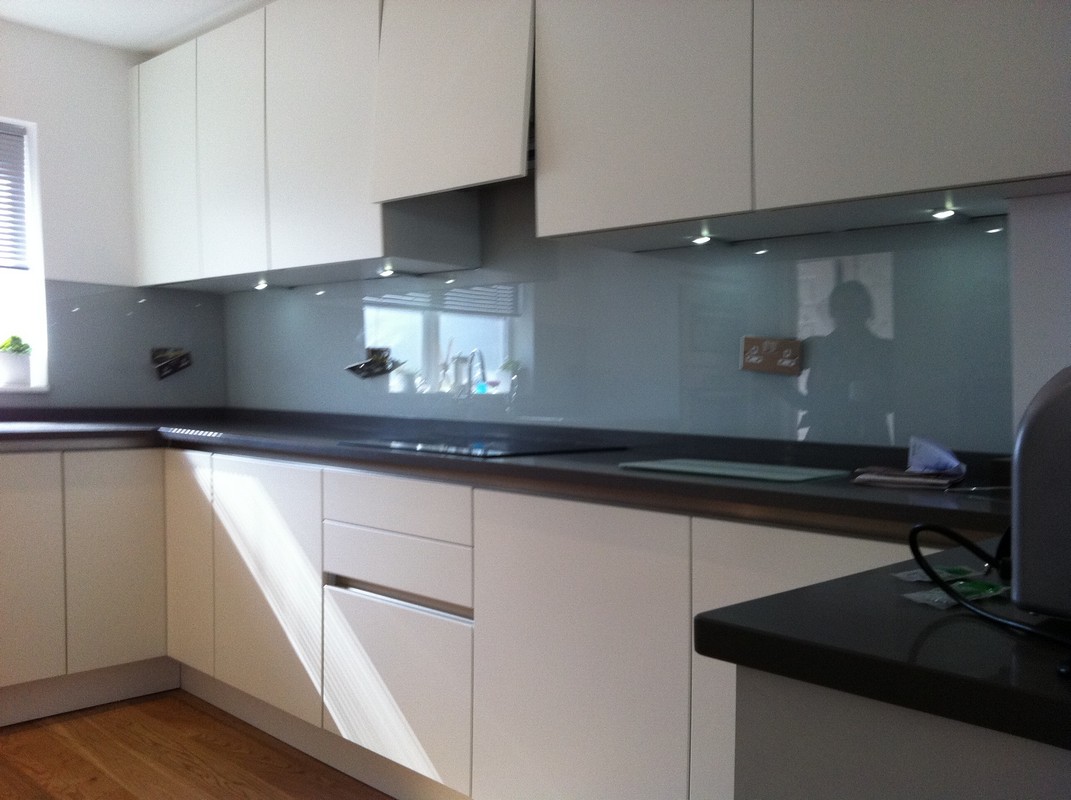 Grey glass kitchen splashback with LED lighting in Banbury