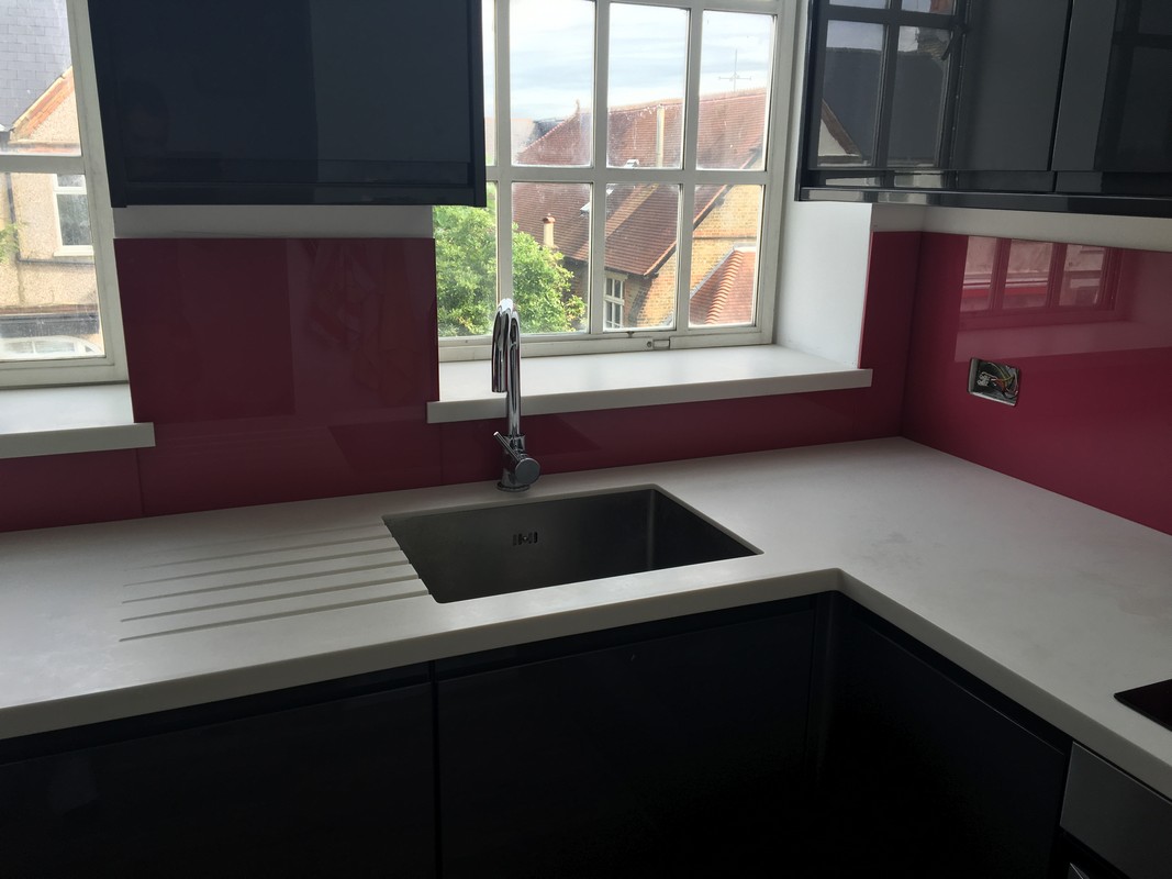 Deep plum coloured glass splashback in modern Banbury kitchen
